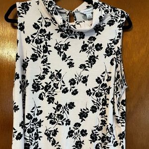 Light pink and black floral women’s tank shirt.